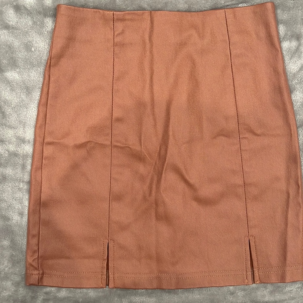 Brown Leather skirt (not real leather). Brand new ! Never worn.